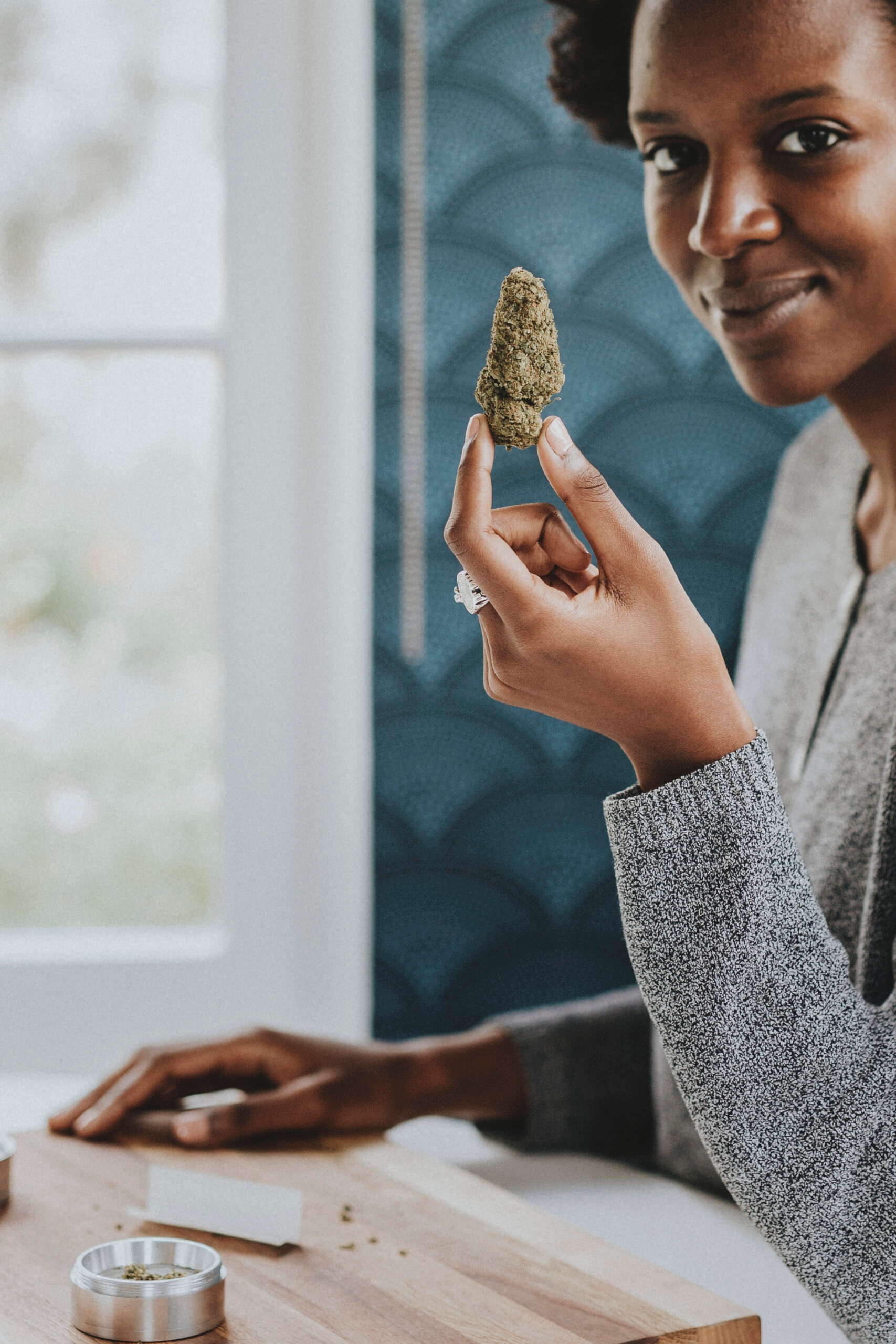 Woman holding weed in hand